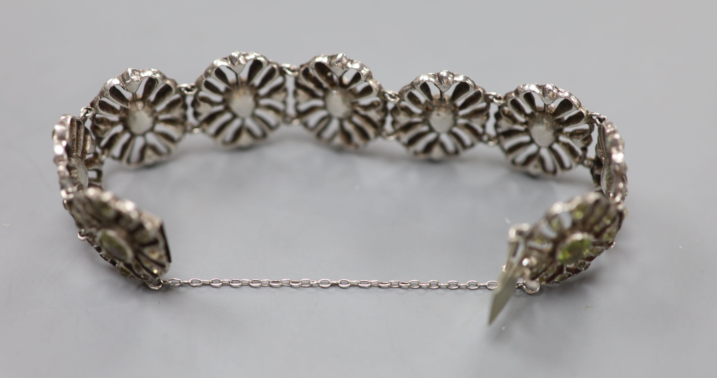 A white metal and two colour paste set oval link bracelet.